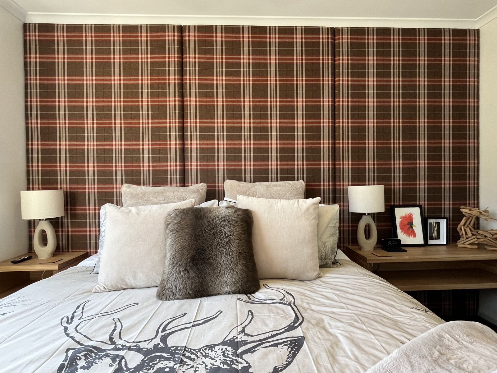 Second bedroom with rust tartan feature wall